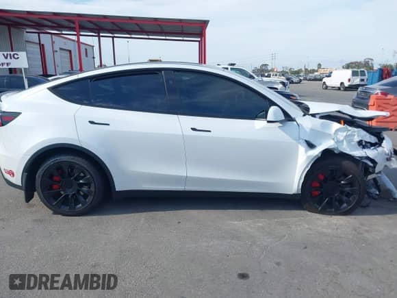 2023 Tesla Model Y Long Range with VIN 7SAYGDEE7PA124885, listed as a IAAI auction lot 43084065 with 22,983 mi miles and . Bid and sale history available at DreamBid. Image 14.