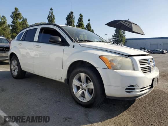 2010 Dodge Caliber SXT with VIN 1B3CB4HA3AD595658, listed as a Copart auction lot 85376495 with 209,626 mi miles and Salvage title. Bid and sale history available at DreamBid. Image 4.