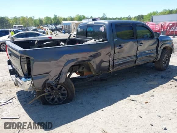 2021 Toyota Tacoma SR5 z VIN 5TFDZ5BN6MX059581, wystawiony jako IAAI lot #42051740 z przebiegiem 65 399 mil mil oraz . Historia ofert i sprzedaży dostępna na DreamBid. Obrazek 4.