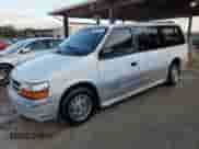 1995 Dodge Caravan with VIN 1B4GH54R1SX617718, listed as a Copart auction lot 79945724 with 107,165 mi miles and Salvage title. Bid and sale history available at DreamBid. Image 1.