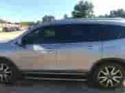 2021 Honda Pilot Touring 7-Passenger with VIN 5FNYF5H69MB000710, listed as a IAAI auction lot 43081838 with 91,899 mi miles and . Bid and sale history available at DreamBid. Image 14.