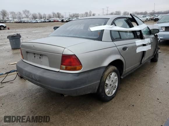 1998 Saturn SL z VIN 1G8ZG5288WZ306574, wystawiony jako Copart lot #86627384 z przebiegiem Nie podano mil oraz Nie do naprawy • Non repairable. Historia ofert i sprzedaży dostępna na DreamBid. Obrazek 3.