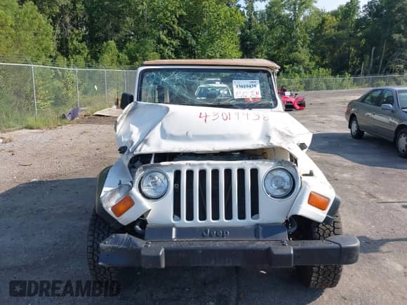 1998 Jeep Wrangler SE z VIN 1J4FY29P5WP712092, wystawiony jako IAAI lot #43019438 z przebiegiem 100 843 mil mil oraz . Historia ofert i sprzedaży dostępna na DreamBid. Obrazek 13.