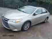 2016 Toyota Camry LE z VIN 4T1BD1FK9GU178077, wystawiony jako IAAI lot #42881844 z przebiegiem 264 207 mil mil oraz . Historia ofert i sprzedaży dostępna na DreamBid. Obrazek 2.