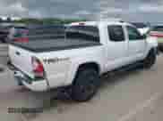 2015 Toyota Tacoma with VIN 3TMLU4EN8FM182145, listed as a IAAI auction lot 42596941 with 251,772 mi miles and . Bid and sale history available at DreamBid. Image 4.