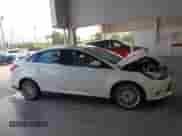 2014 Ford Focus Titanium with VIN 1FADP3J2XEL106711, listed as a IAAI auction lot 43371614 with 114,736 mi miles and . Bid and sale history available at DreamBid. Image 13.