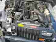 1992 Jeep Wrangler with VIN 2J4FY29S0NJ550114, listed as a Copart auction lot 68966325 with 142,331 mi miles and Salvage title. Bid and sale history available at DreamBid. Image 11.