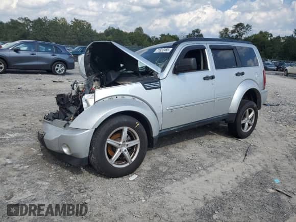2007 Dodge Nitro SLT z VIN 1D8GT58K97W619567, wystawiony jako Copart lot #71322465 z przebiegiem 234 159 mil mil oraz Szkoda całkowita • Salvage title. Historia ofert i sprzedaży dostępna na DreamBid. Obrazek 1.