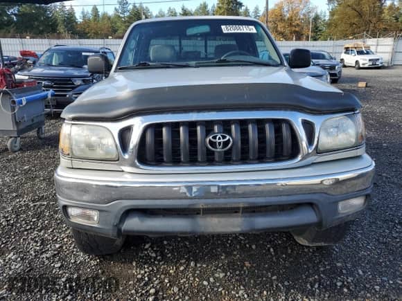 2001 Toyota Tacoma с VIN 5TEWN72N11Z840707, выставлен на аукционе Copart как лот 82088715 с пробегом 405 448 миль миль и Списание • Salvage title. История ставок и продаж доступна на DreamBid. Изображение 5.