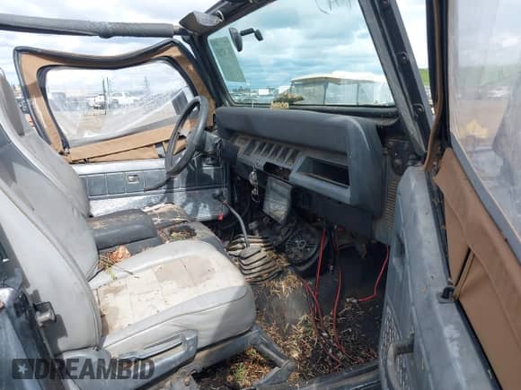 1993 Jeep Wrangler S z VIN 1J4FY19P5PP254999, wystawiony jako IAAI lot #41742888 z przebiegiem 189 678 mil mil oraz . Historia ofert i sprzedaży dostępna na DreamBid. Obrazek 5.