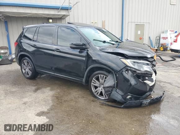 2020 Honda Passport EX-L with VIN 5FNYF7H52LB002560, listed as a Copart auction lot 61340085 with 83,206 mi miles and Salvage title. Bid and sale history available at DreamBid. Image 4.