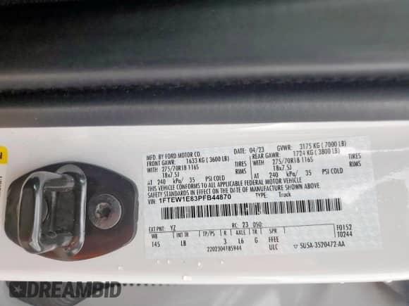 2023 Ford F-150 XL with VIN 1FTEW1E83PFB44870, listed as a Copart auction lot 67404595 with 69,006 mi miles and Salvage title. Bid and sale history available at DreamBid. Image 12.