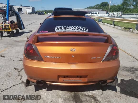 2006 Hyundai Tiburon GT with VIN KMHHN65F66U191134, listed as a Copart auction lot 56692615 with 197,093 mi miles and Salvage title. Bid and sale history available at DreamBid. Image 6.