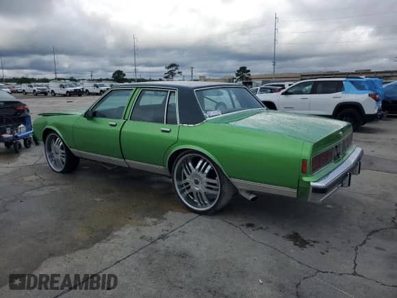 1986 Chevrolet Caprice с VIN 1G1BN69H0GX199034, выставлен на аукционе Copart как лот 55844705 с пробегом Не указан миль и Списание • Salvage title. История ставок и продаж доступна на DreamBid. Изображение 2.