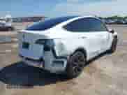 2023 Tesla Model Y Long Range z VIN 7SAYGDEE0PA178495, wystawiony jako IAAI lot #42507571 z przebiegiem 55 840 mil mil oraz . Historia ofert i sprzedaży dostępna na DreamBid. Obrazek 4.