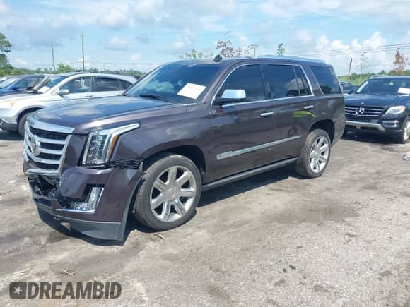 2015 Cadillac Escalade Premium z VIN 1GYS4CKJ7FR152473, wystawiony jako IAAI lot #43072759 z przebiegiem 165 732 mil mil oraz . Historia ofert i sprzedaży dostępna na DreamBid. Obrazek 2.