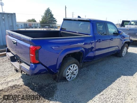2024 Toyota Tacoma TRD Off Road with VIN 3TMLB5JN7RM001123, listed as a IAAI auction lot 43085472 with 35,813 mi miles and . Bid and sale history available at DreamBid. Image 4.