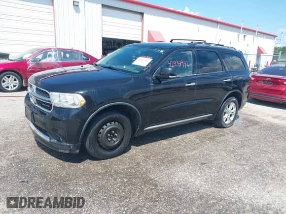 2013 Dodge Durango Crew with VIN 1C4RDJDG0DC664649, listed as a IAAI auction lot 42934942 with 152,231 mi miles and . Bid and sale history available at DreamBid. Image 2.