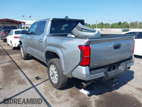 2024 Toyota Tacoma TRD Off Road with VIN 3TMLB5JN8RM010395, listed as a IAAI auction lot 43375716 with 20,319 mi miles and . Bid and sale history available at DreamBid. Image 3.