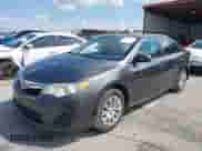 2014 Toyota Camry LE with VIN 4T1BF1FK0EU424330, listed as a IAAI auction lot 43042804 with 166,879 mi miles and . Bid and sale history available at DreamBid. Image 2.