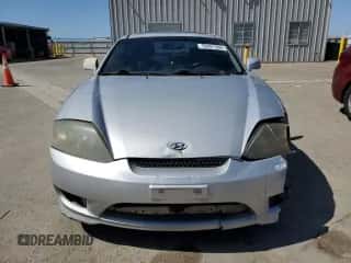 2006 Hyundai Tiburon GT с VIN KMHHN65F26U225506, выставлен на аукционе Copart как лот 56997285 с пробегом 170 175 миль миль и Списание • Salvage title. История ставок и продаж доступна на DreamBid. Изображение 5.