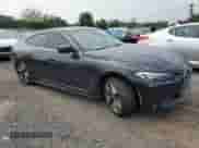 2023 BMW i4 eDrive35 with VIN WBY43AW0XPFP92914, listed as a Copart auction lot 66748865 with 32,088 mi miles and Salvage title. Bid and sale history available at DreamBid. Image 4.