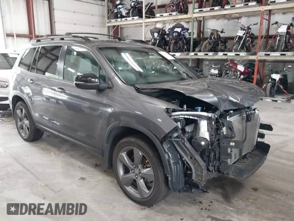2021 Honda Passport Touring with VIN 5FNYF8H96MB024362, listed as a IAAI auction lot 43014824 with 46,022 mi miles and . Bid and sale history available at DreamBid. Image 1.