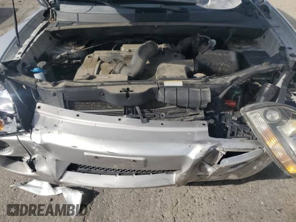 2005 Hyundai Tucson GL z VIN KM8JM12B05U069649, wystawiony jako Copart lot #66017225 z przebiegiem 104 931 mil mil oraz Szkoda całkowita • Salvage title. Historia ofert i sprzedaży dostępna na DreamBid. Obrazek 12.