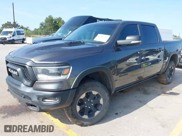 2019 Ram 1500 Rebel z VIN 1C6SRFLT4KN698648, wystawiony jako IAAI lot #42506713 z przebiegiem 143 425 mil mil oraz . Historia ofert i sprzedaży dostępna na DreamBid. Obrazek 17.
