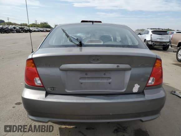 2004 Hyundai Accent GL z VIN KMHCG35C34U290855, wystawiony jako Copart lot #70719664 z przebiegiem 176 210 mil mil oraz Szkoda całkowita • Salvage title. Historia ofert i sprzedaży dostępna na DreamBid. Obrazek 6.