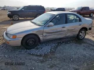 1997 Honda Accord Special Edition with VIN 1HGCD5608VA053067, listed as a Copart auction lot 70016605 with 144,073 mi miles and Salvage title. Bid and sale history available at DreamBid. Image 1.