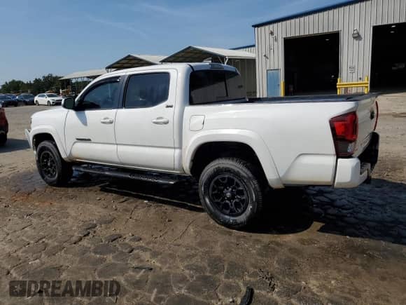 2022 Toyota Tacoma SR5 with VIN 3TMAZ5CN3NM184188, listed as a Copart auction lot 80107995 with 67,428 mi miles and Salvage title. Bid and sale history available at DreamBid. Image 2.