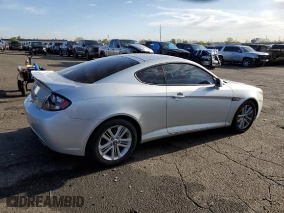 2007 Hyundai Tiburon GS with VIN KMHHM66DX7U246220, listed as a Copart auction lot 53555715 with 105,305 mi miles and Salvage title. Bid and sale history available at DreamBid. Image 3.