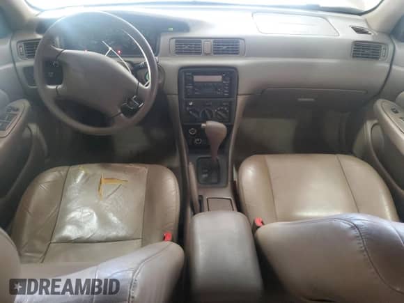 2001 Toyota Camry CE with VIN 4T1BG22K91U099292, listed as a Copart auction lot 82776065 with 201,757 mi miles and Salvage title. Bid and sale history available at DreamBid. Image 8.