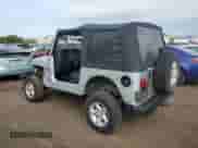 2005 Jeep Wrangler X with VIN 1J4FA39S35P323755, listed as a Copart auction lot 81223145 with 150,964 mi miles and Salvage title. Bid and sale history available at DreamBid. Image 2.