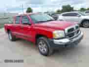 2005 Dodge Dakota SLT with VIN 1D7HE48N75S126353, listed as a IAAI auction lot 42591862 with 239,472 mi miles and . Bid and sale history available at DreamBid. Image 1.