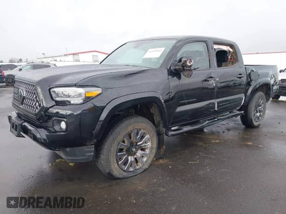 2022 Toyota Tacoma Limited with VIN 3TMGZ5AN4NM463887, listed as a IAAI auction lot 41592060 with 61,026 mi miles and . Bid and sale history available at DreamBid. Image 2.