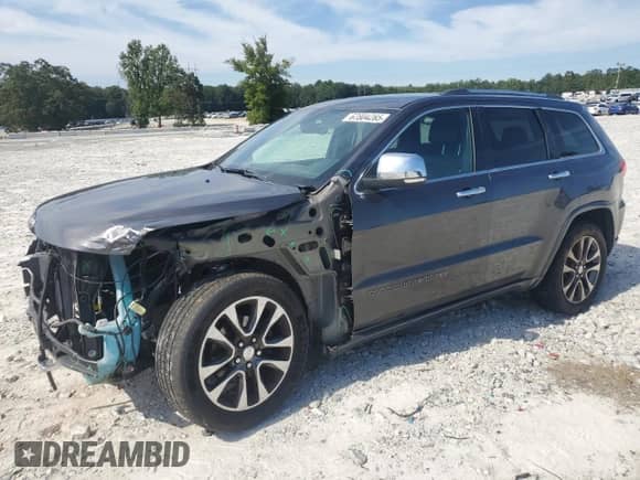 2017 Jeep Grand Cherokee Overland with VIN 1C4RJFCG9HC800659, listed as a Copart auction lot 67804285 with 105,483 mi miles and Salvage title. Bid and sale history available at DreamBid. Image 1.