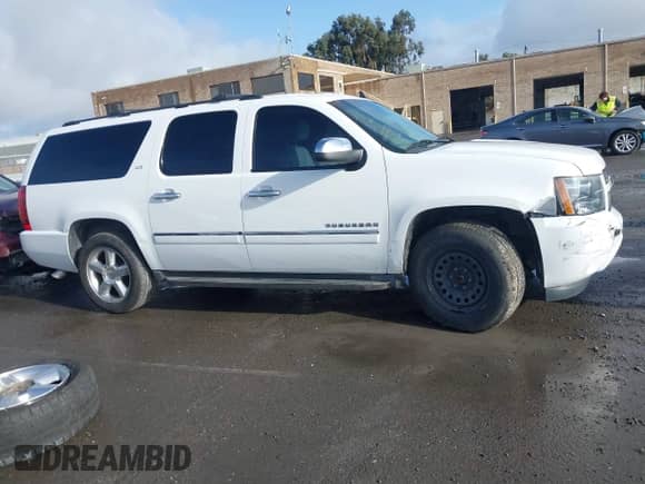 2014 Chevrolet Suburban LTZ with VIN 1GNSKKE79ER139252, listed as a IAAI auction lot 41197789 with 170,065 mi miles and . Bid and sale history available at DreamBid. Image 14.