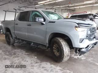 2024 Chevrolet Silverado 1500 Custom Trail Boss with VIN 3GCUDCEDXRG355740, listed as a IAAI auction lot 42147056 with 12,987 mi miles and . Bid and sale history available at DreamBid. Image 1.