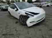 2022 Tesla Model Y Long Range with VIN 7SAYGAEE7NF465170, listed as a Copart auction lot 80191505 with 95,332 mi miles and Salvage title. Bid and sale history available at DreamBid. Image 14.