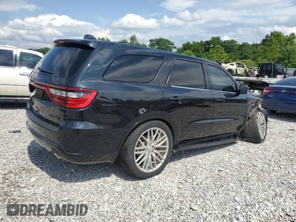 2015 Dodge Durango R/T with VIN 1C4SDJCTXFC786745, listed as a Copart auction lot 65772265 with 163,731 mi miles and Salvage title. Bid and sale history available at DreamBid. Image 3.