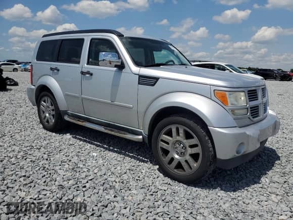 2011 Dodge Nitro Heat with VIN 1D4PT4GK5BW605204, listed as a Copart auction lot 52677235 with 104,039 mi miles and Salvage title. Bid and sale history available at DreamBid. Image 4.