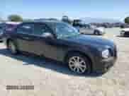 2005 Chrysler 300 C with VIN 2C3AA63H25H150558, listed as a Copart auction lot 81831055 with 128,748 mi miles and Salvage title. Bid and sale history available at DreamBid. Image 4.