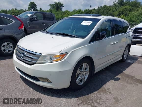 2012 Honda Odyssey Touring с VIN 5FNRL5H99CB115300, выставлен на аукционе IAAI как лот 42890660 с пробегом 120 808 миль миль и . История ставок и продаж доступна на DreamBid. Изображение 2.
