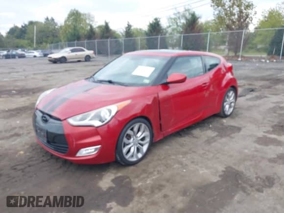 2013 Hyundai Veloster w/Black Int z VIN KMHTC6AD2DU144460, wystawiony jako IAAI lot #43311265 z przebiegiem 188 653 mil mil oraz . Historia ofert i sprzedaży dostępna na DreamBid. Obrazek 2.