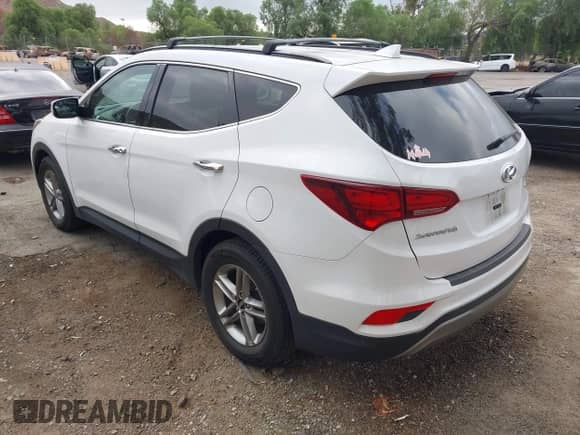 2018 Hyundai Santa Fe 2.4L с VIN 5XYZU3LB3JG521526, выставлен на аукционе IAAI как лот 43433382 с пробегом 152 194 миль миль и . История ставок и продаж доступна на DreamBid. Изображение 3.