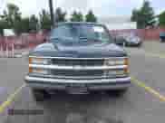 1999 Chevrolet Suburban z VIN 3GNFK16R6XG146089, wystawiony jako IAAI lot #43432599 z przebiegiem 153 966 mil mil oraz . Historia ofert i sprzedaży dostępna na DreamBid. Obrazek 6.