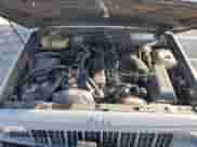 1990 Jeep Grand Cherokee with VIN 1J4FJ87L2LL112530, listed as a Copart auction lot 81328944 with 140,672 mi miles and Clean title. Bid and sale history available at DreamBid. Image 12.