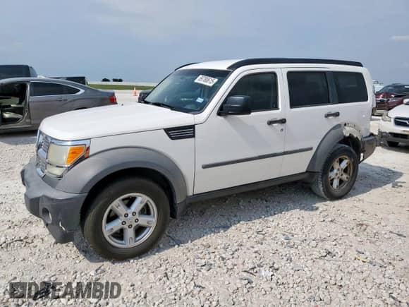 2007 Dodge Nitro SXT z VIN 1D8GT28K67W597011, wystawiony jako Copart lot #69780615 z przebiegiem 144 494 mil mil oraz Szkoda całkowita • Salvage title. Historia ofert i sprzedaży dostępna na DreamBid. Obrazek 1.